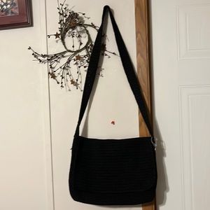 The Sak with flap 9.5x 13 inches black with Sak emblem